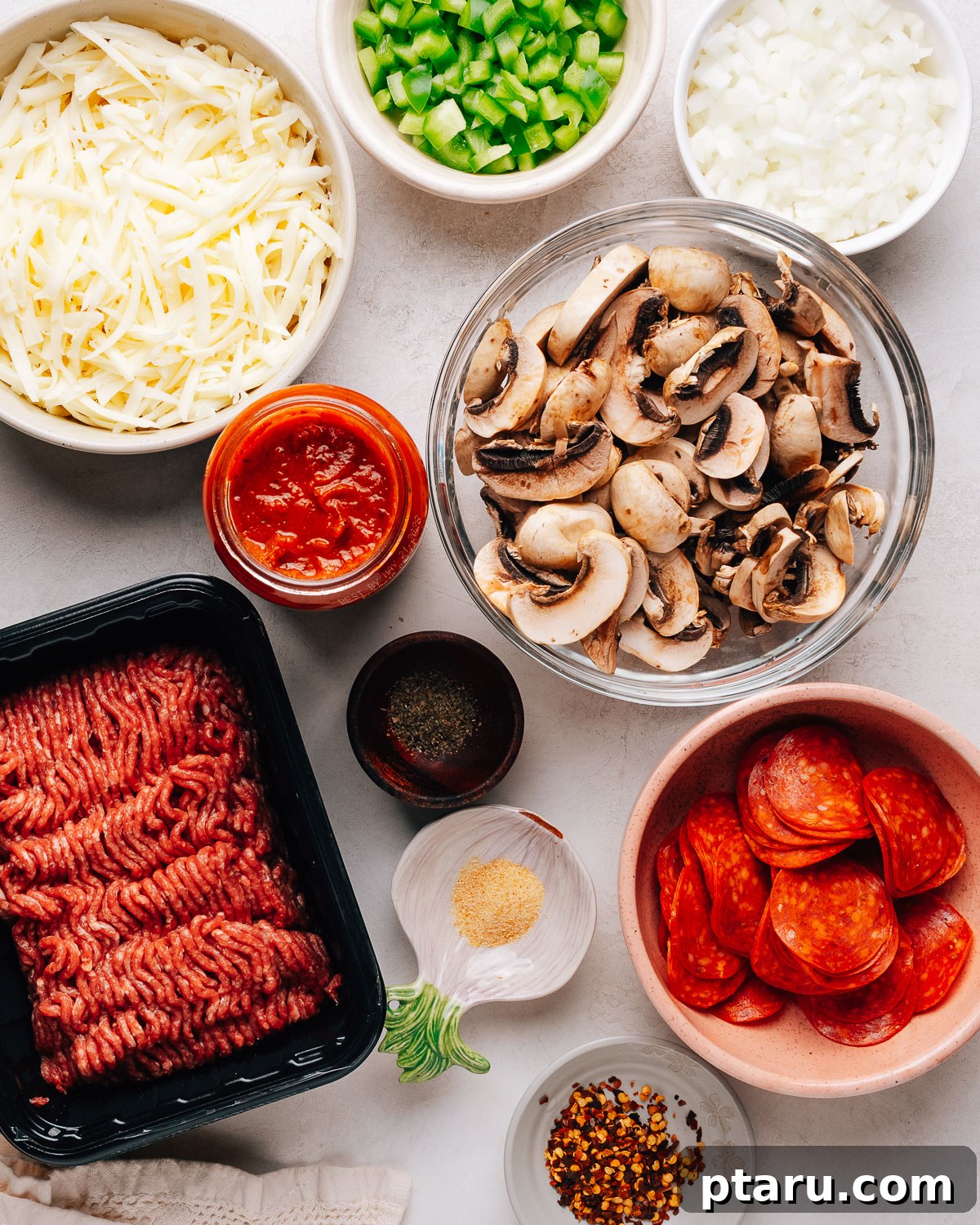 Loaded Cheesy Pizza Bowl Recipe 3 Pizza bowl ingredients on the counter.