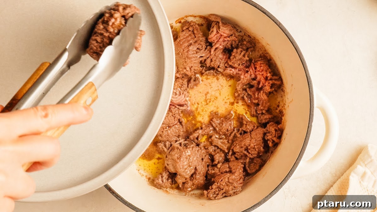 Loaded Cheesy Pizza Bowl Recipe 4 Step 1: ground beef browned in a Dutch oven for pizza bowls.