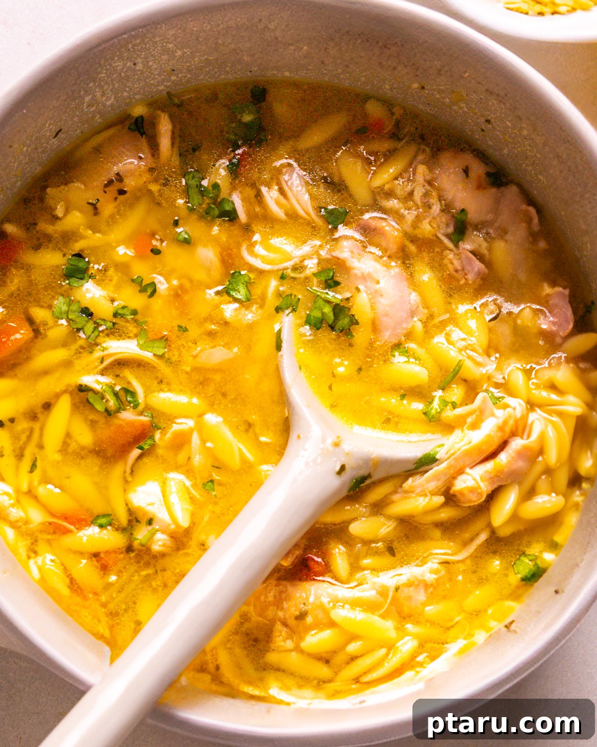 57 Comforting Soup Recipes for Every Occasion 3 Lemon chicken orzo soup with fresh dill and orzo pasta in a bowl.