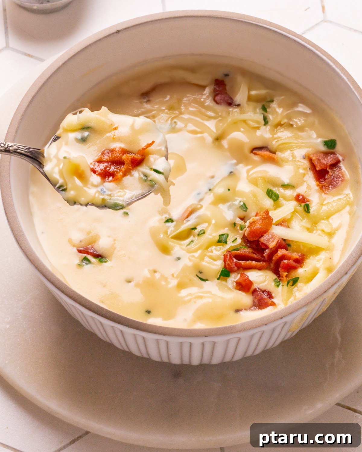 57 Comforting Soup Recipes for Every Occasion 29 Creamy easy potato soup topped with chives and cracked black pepper.