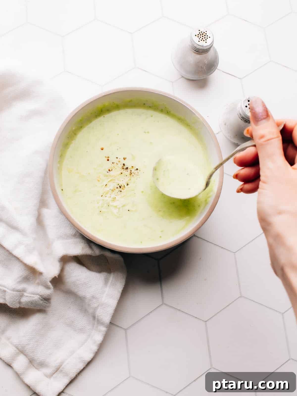 57 Comforting Soup Recipes for Every Occasion 30 Creamy potato zucchini soup blended smooth in a wide bowl.