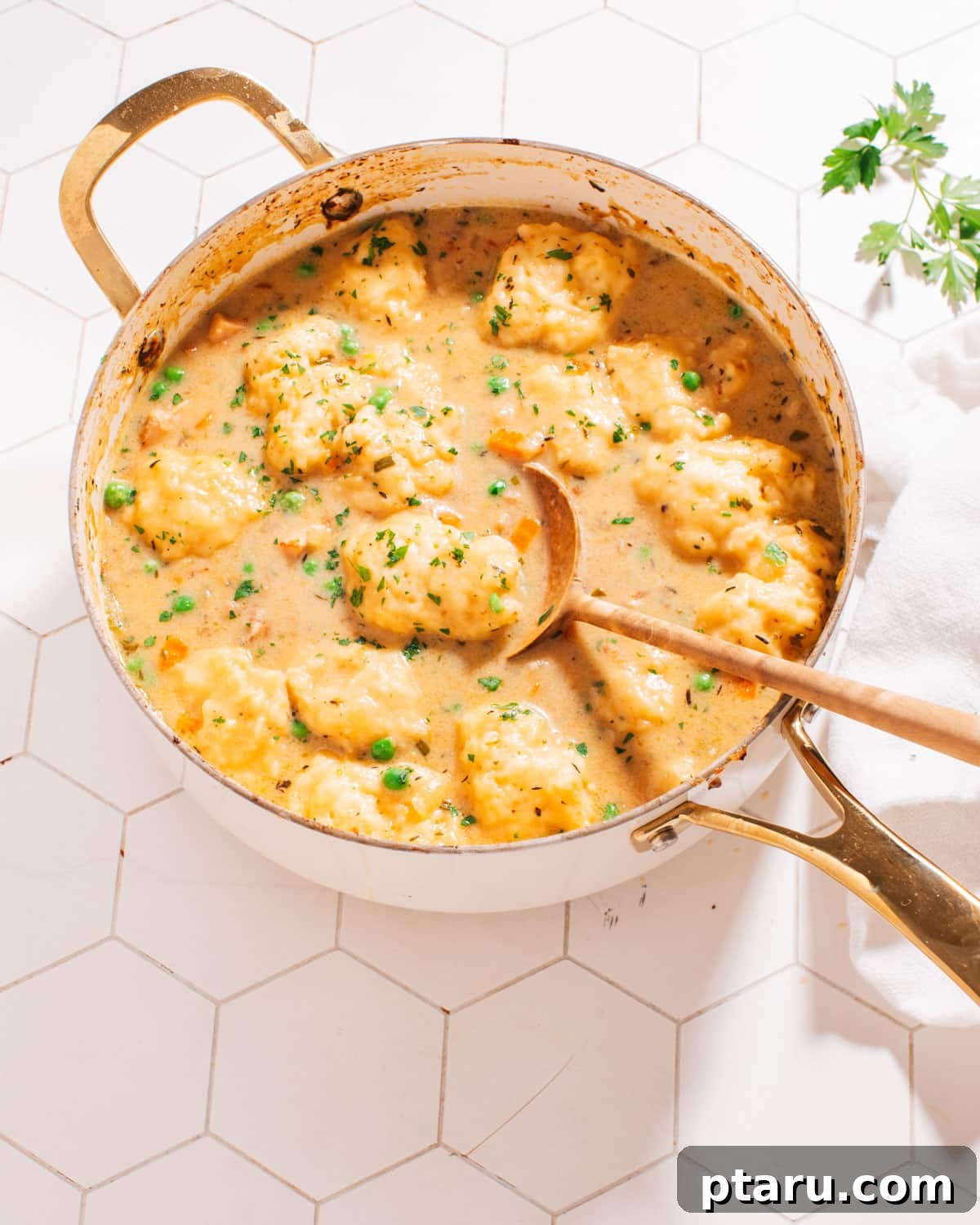57 Comforting Soup Recipes for Every Occasion 4 Chicken and dumpling soup with fluffy drop dumplings on top.