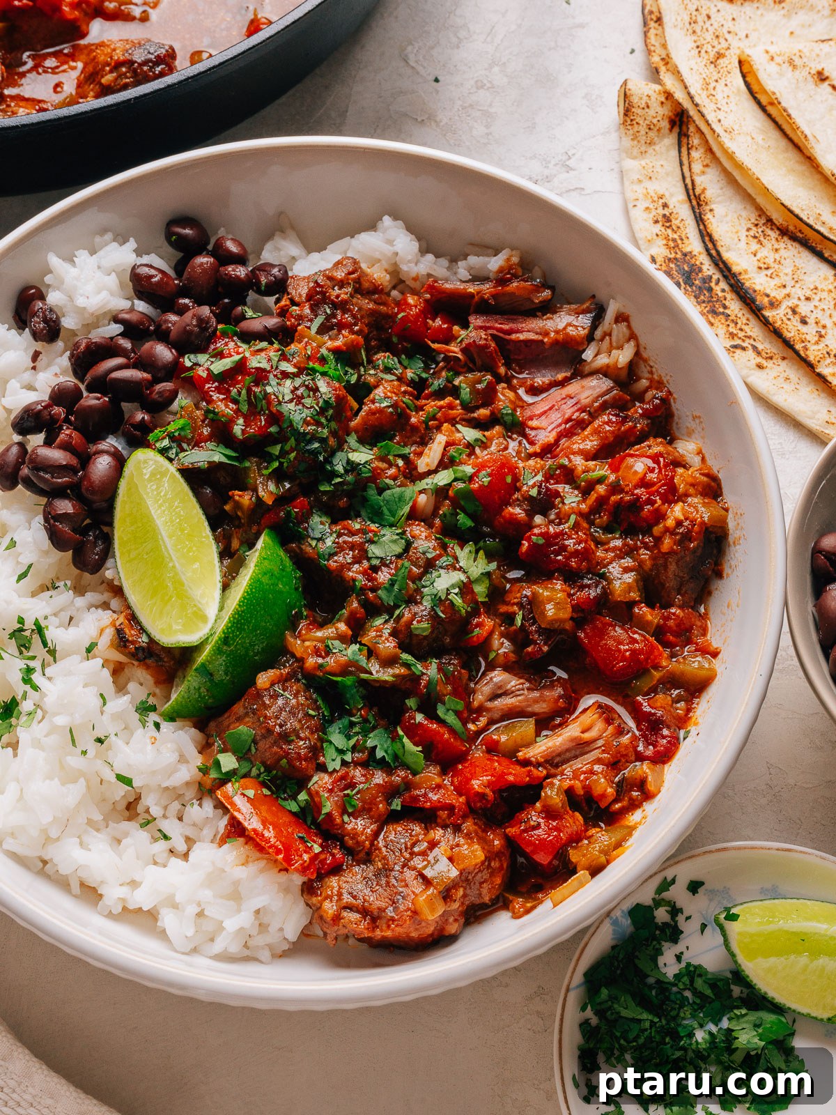 57 Comforting Soup Recipes for Every Occasion 39 A bowl of carne guisada with rice.