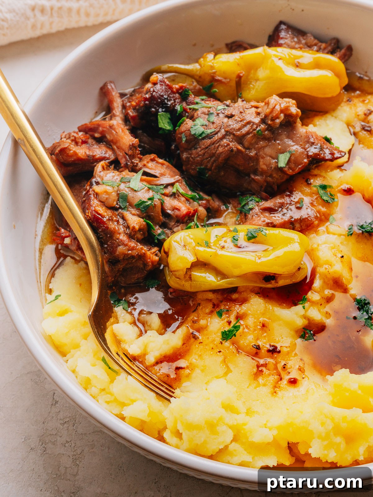 Slow-Cooker Mississippi Pot Roast 11 Shredded Mississippi pot roast in its buttery pan juices with pepperoncini peppers.