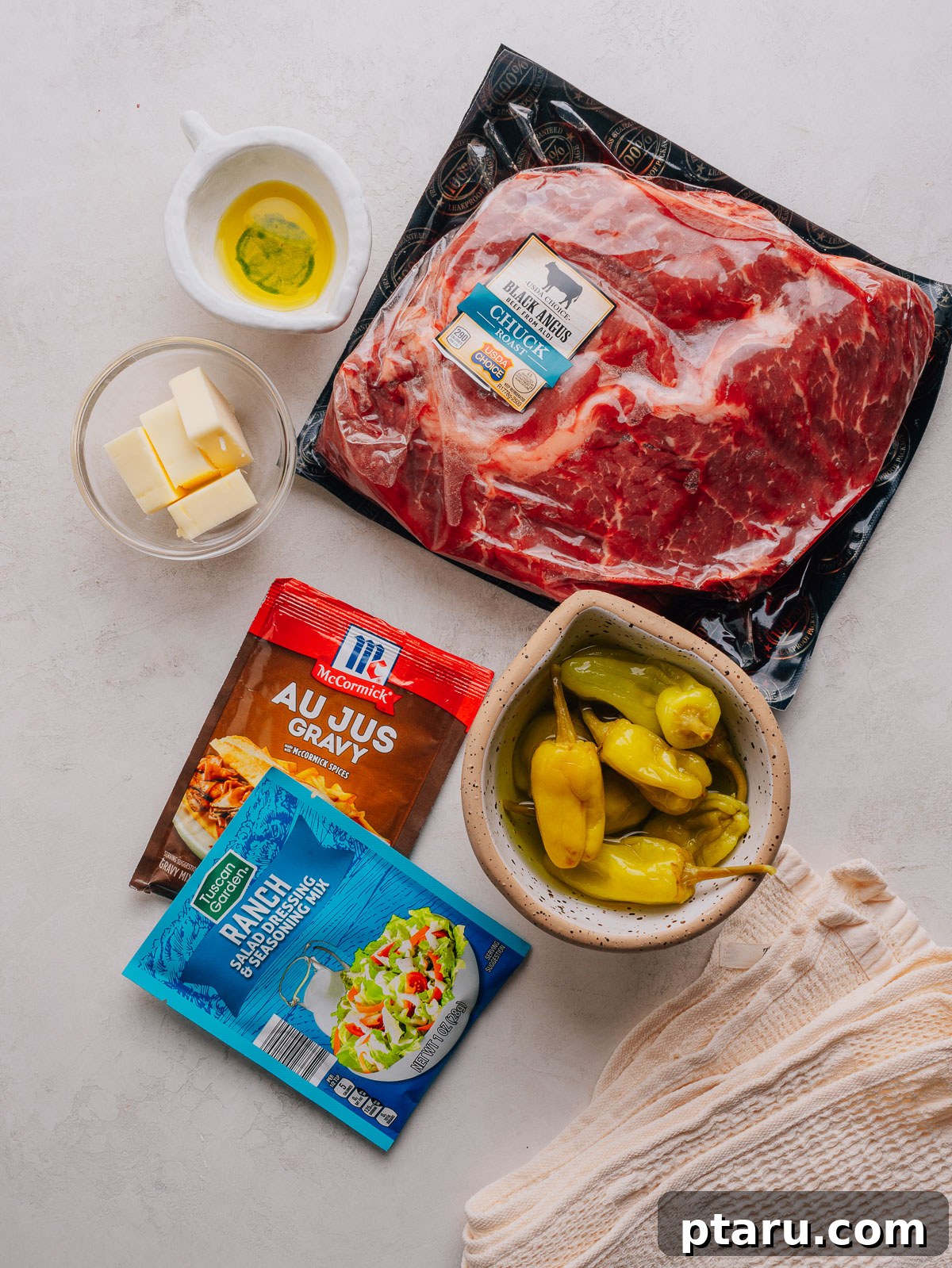Slow-Cooker Mississippi Pot Roast 3 Ingredients for Mississippi pot roast laid out on a counter.