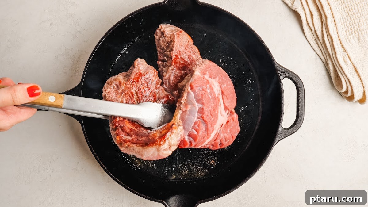 Slow-Cooker Mississippi Pot Roast 4 Searing the chuck roast in a hot skillet until deeply browned.