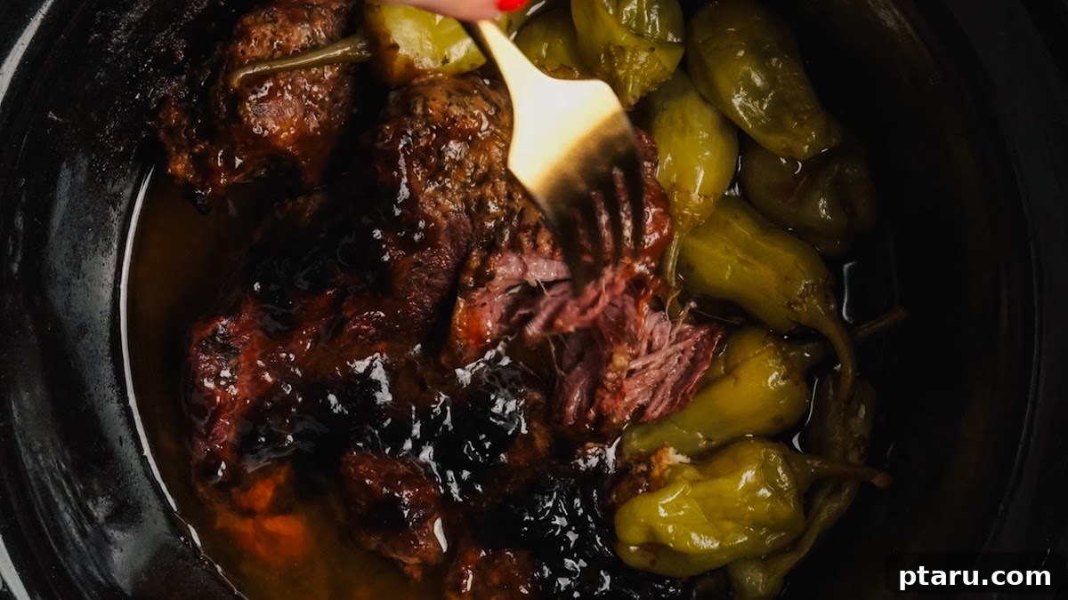 Slow-Cooker Mississippi Pot Roast 8 Fork-tender Mississippi pot roast after slow cooking.