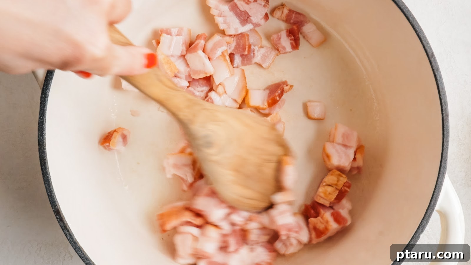 Thick Southern Baked Beans with Bacon (No-Soak Recipe) 4 Chopped thick-cut bacon rendering in a Dutch oven.