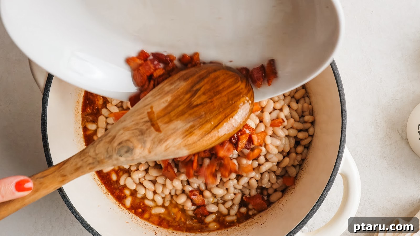 Thick Southern Baked Beans with Bacon (No-Soak Recipe) 7 Canned cannellini beans and bacon stirred into the sauce.