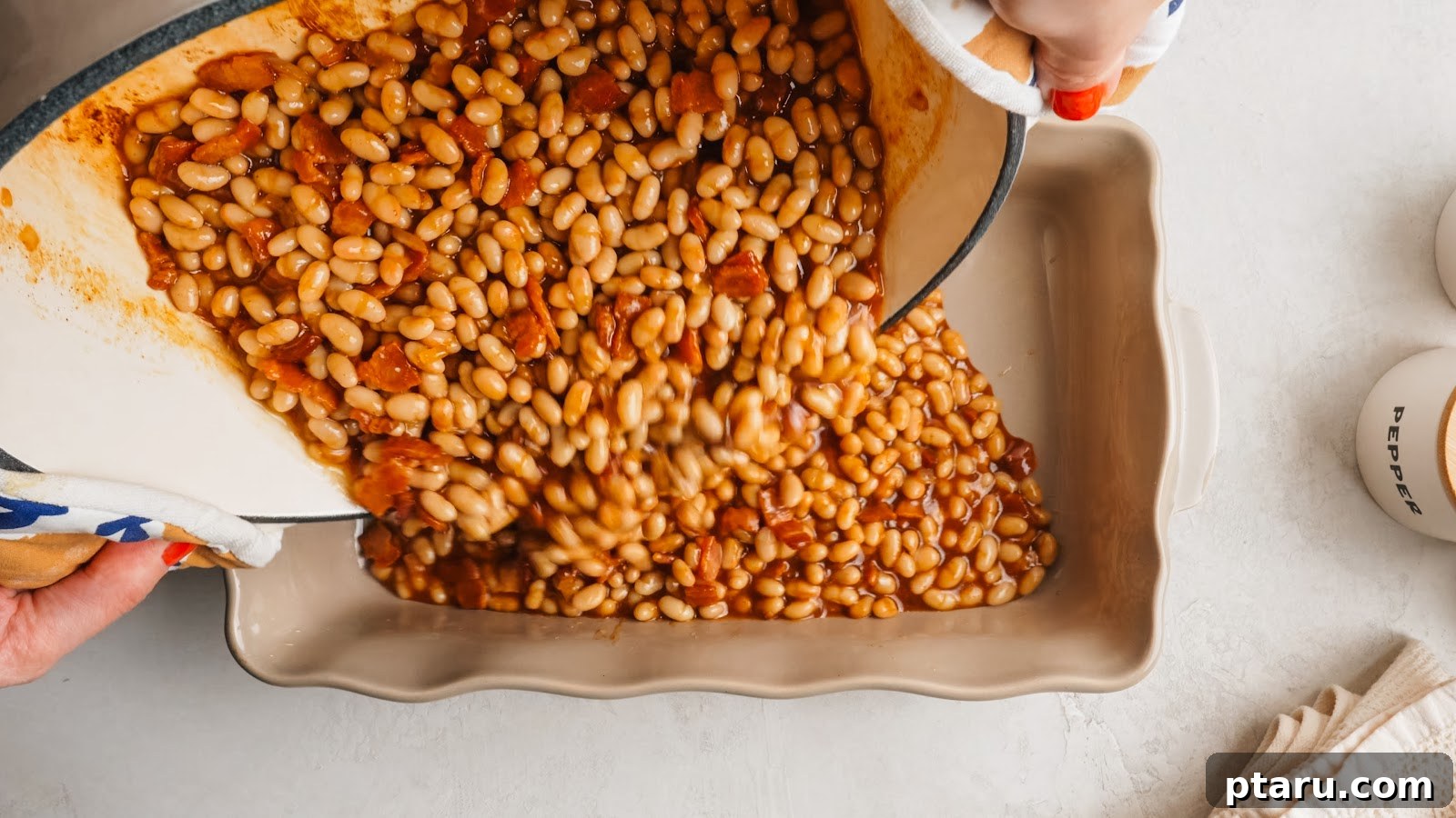 Thick Southern Baked Beans with Bacon (No-Soak Recipe) 8 The beans spread into a 9x13 baking dish before baking.