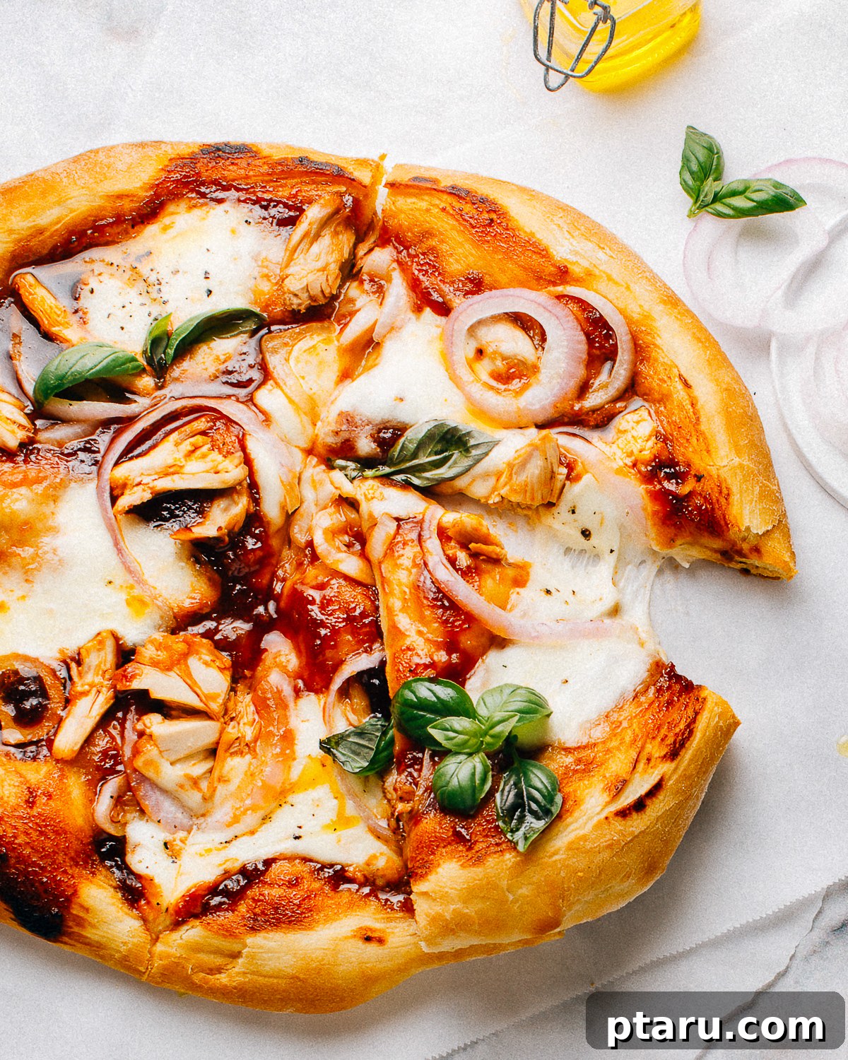 Smoky BBQ Chicken Flatbread with Caramelized Onions 2 Sliced BBQ chicken flatbread cut into strips.