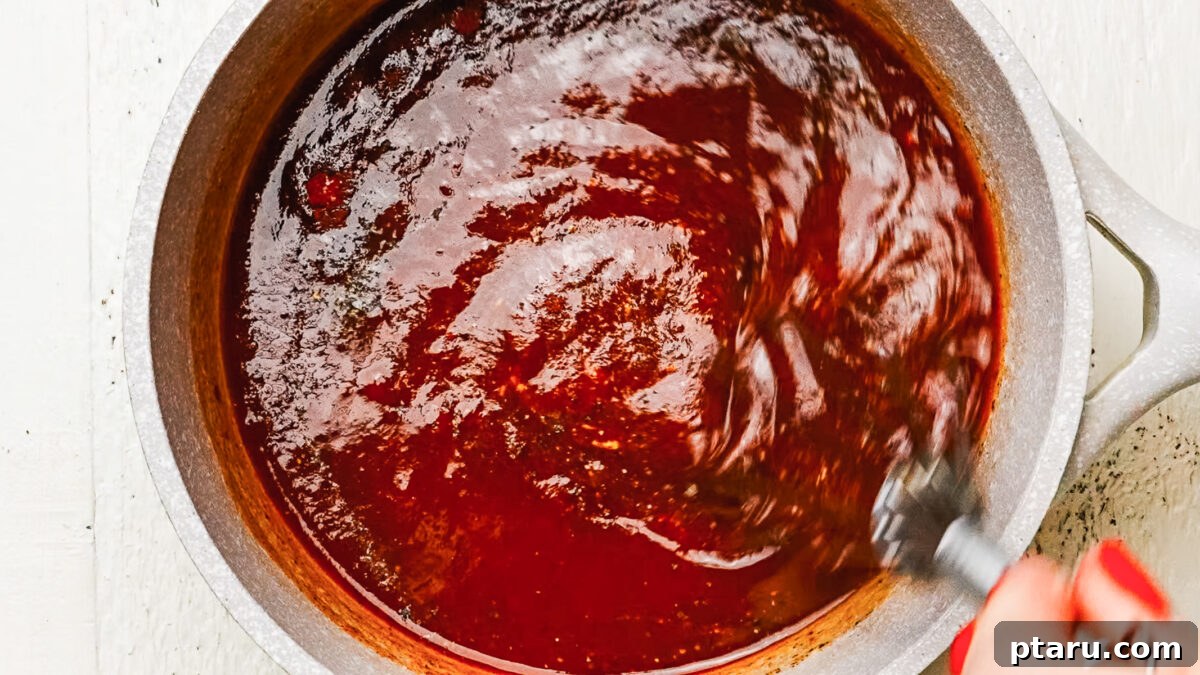 Homemade Honey BBQ Sauce Recipe 6 Finished honey BBQ sauce in a saucepan.