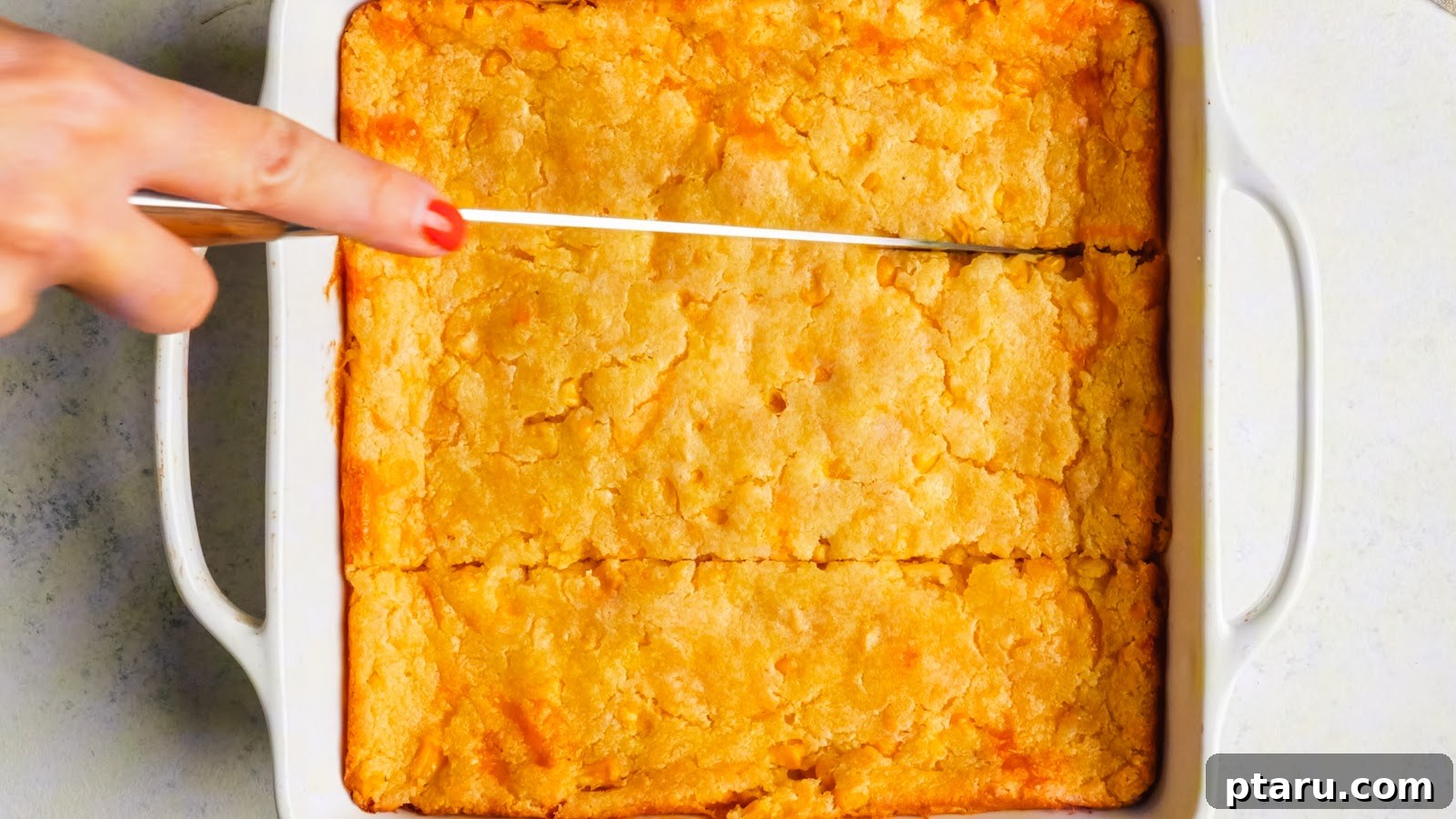 Creamy Jiffy Corn Casserole Recipe: Soft & Comforting 4 Baked corn casserole cut into squares