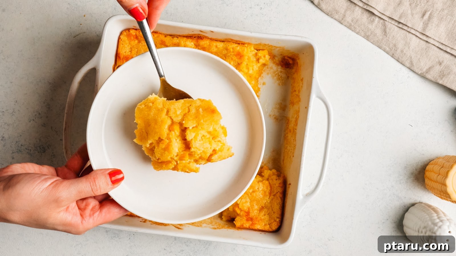 Creamy Jiffy Corn Casserole Recipe: Soft & Comforting 10 Spoonful of corn casserole on a plate
