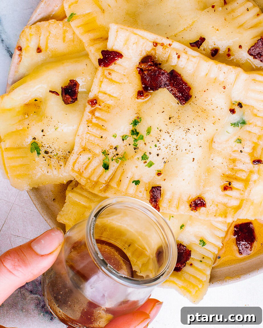 Pumpkin Ravioli Sauce: Brown Butter and Sage 7 Brown butter sage sauce poured over a plate of cooked pumpkin ravioli.