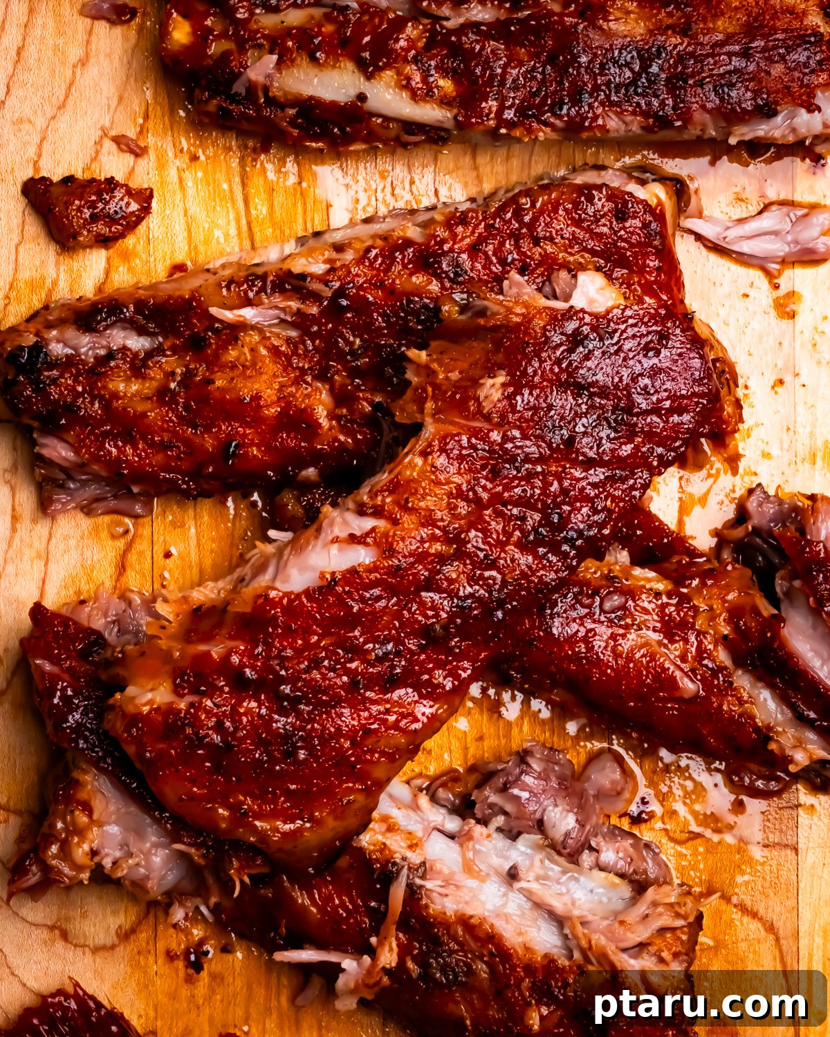 Sweet Dry Rub for Ribs: Flavorful BBQ Seasoning 2 Sweet and Spicy Dry Rub on sliced ribs.