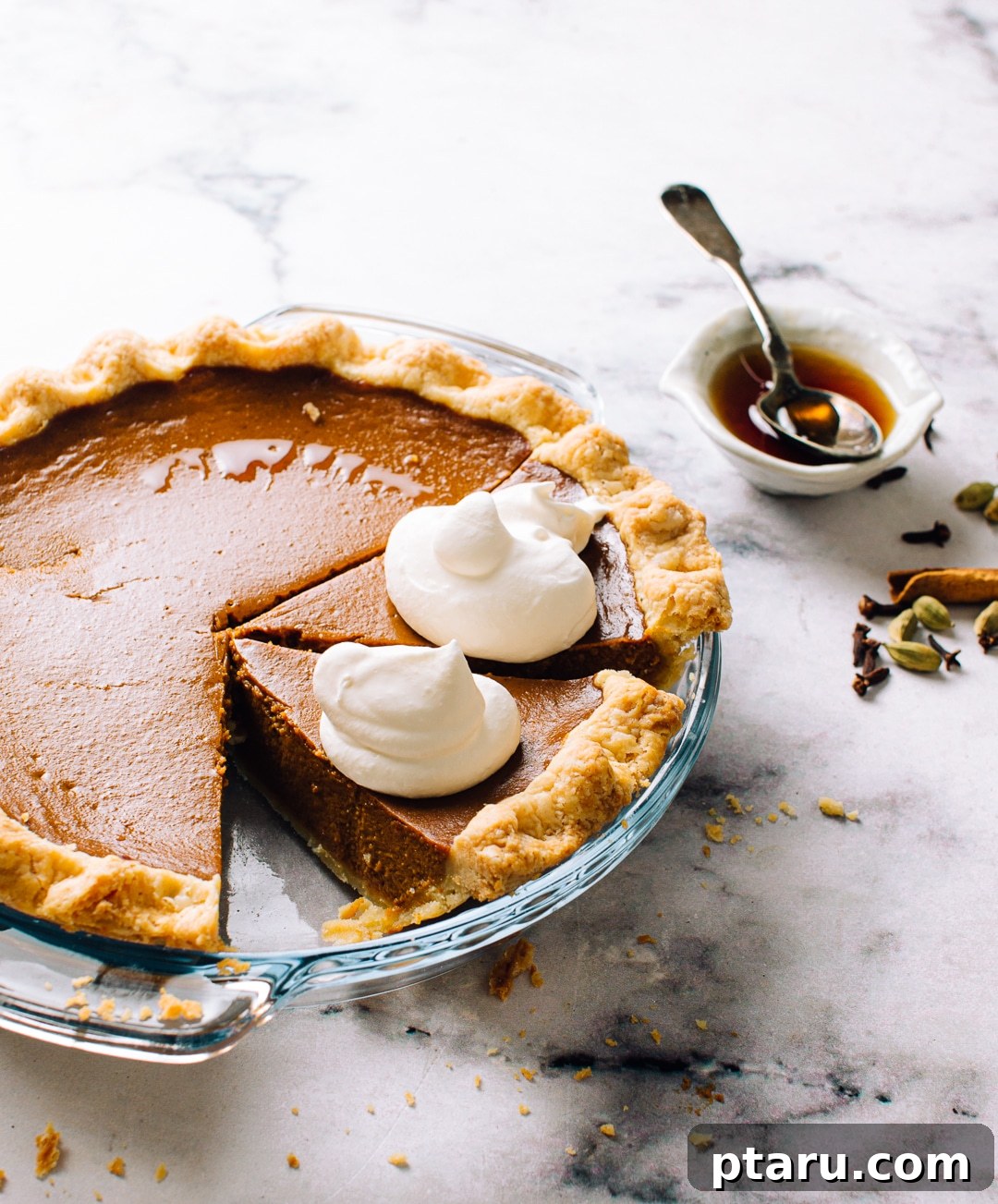48 Pie Recipes: Fruit, Cream, Savory Pies and Tarts 6 A pumpkin pie with a crimped crust and whipped cream.