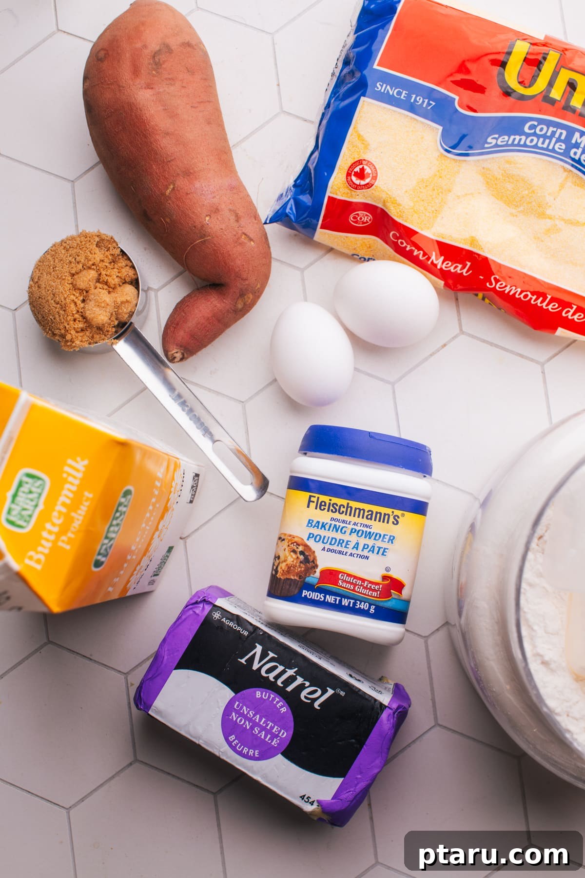 How to Make Moist Sweet Potato Cornbread 3 Ingredients for sweet potato cornbread laid out on a tiled counter.