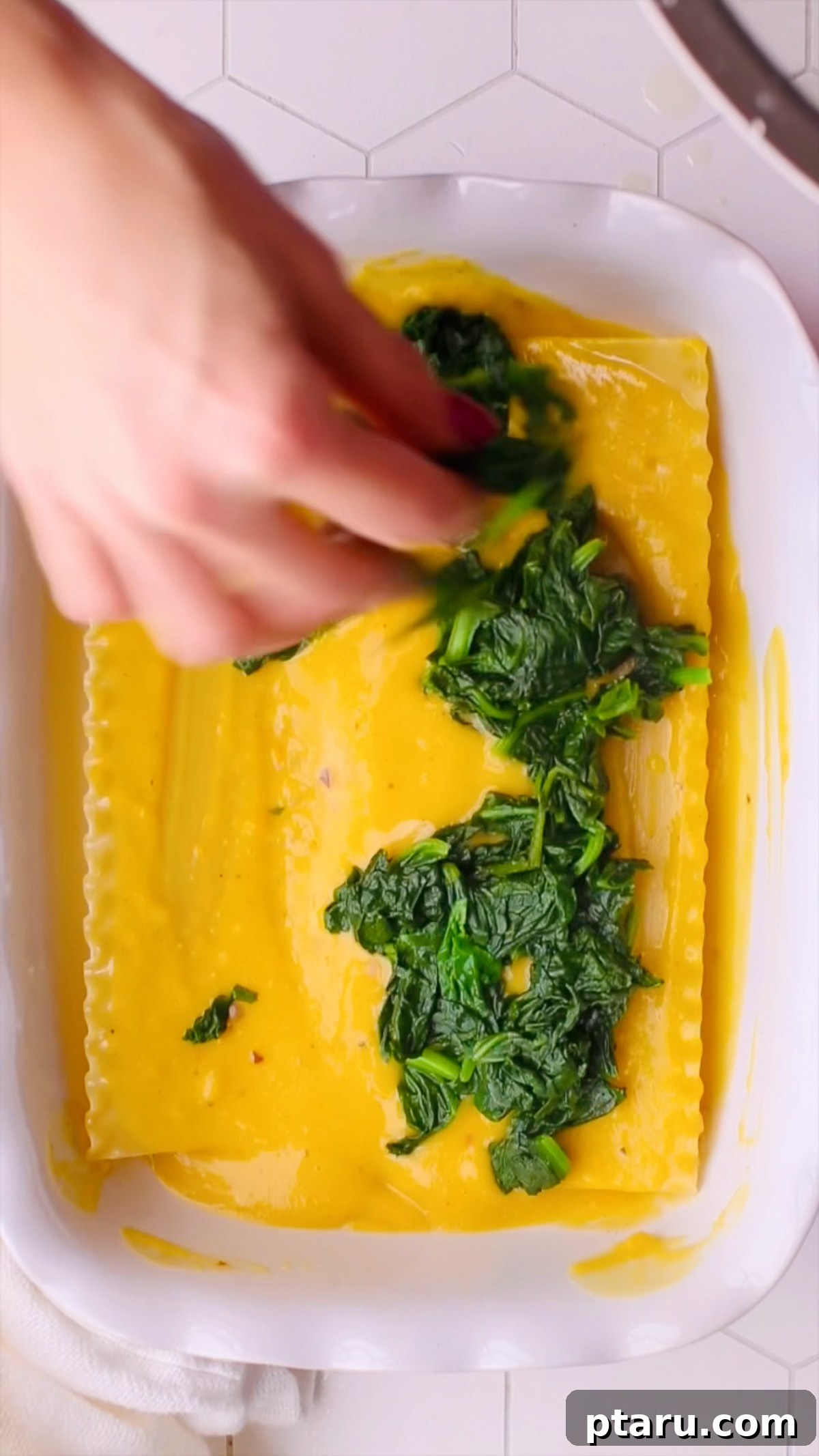 Butternut Squash Lasagna with Creamy Béchamel 11 Wilted spinach scattered over the butternut squash sauce layer.
