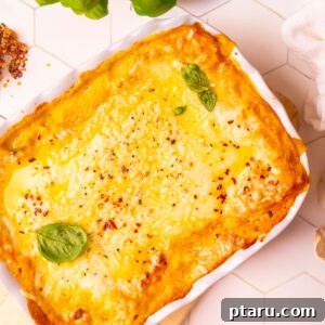 Butternut Squash Lasagna with Creamy Béchamel 18 Butternut squash lasagna with golden, bubbly cheese in a white baking dish.