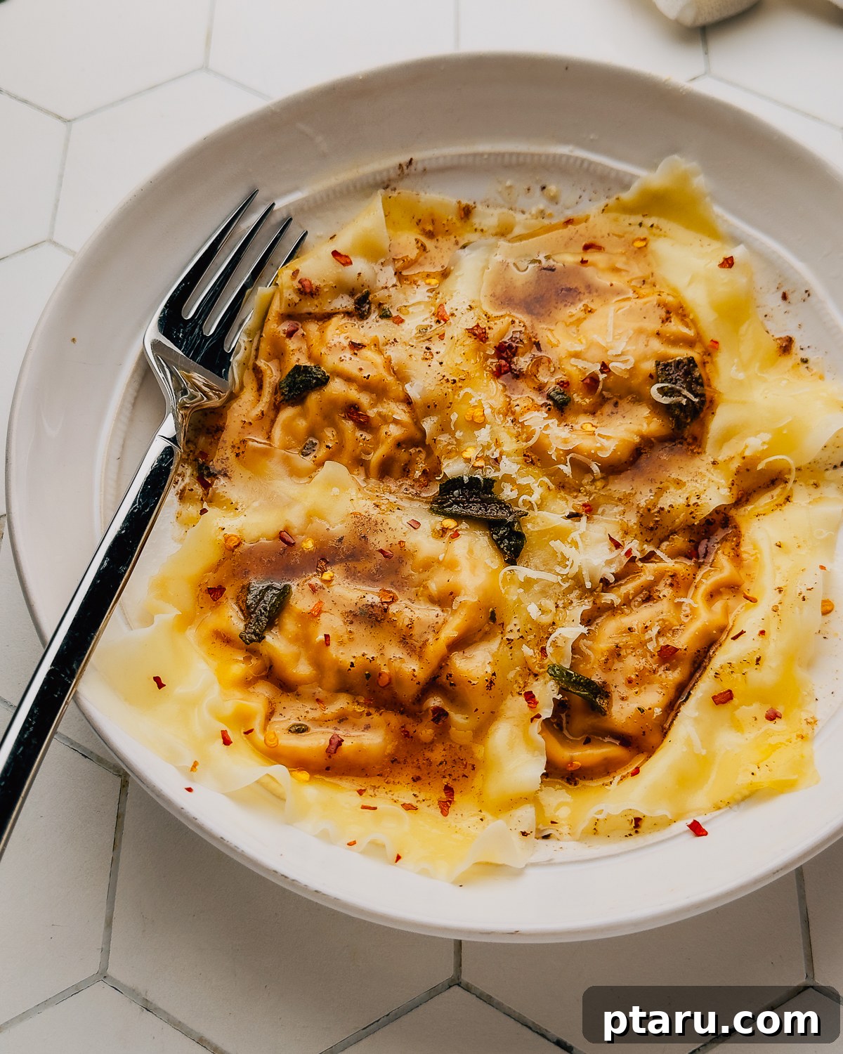 Homemade Pumpkin Ravioli Made with Wonton Wrappers 2 Pumpkin ravioli made with wonton wrappers, tossed in brown butter sage sauce with Parmesan and red pepper flakes.