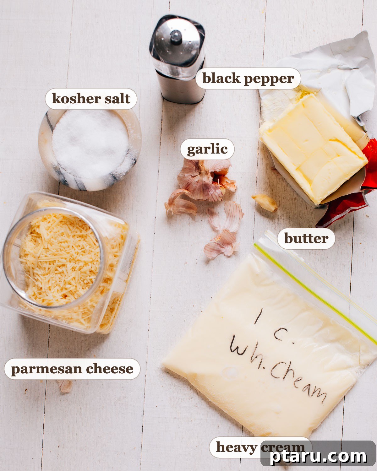 How to Make Garlic Cream Sauce 3 Labeled garlic cream sauce ingredients: butter, garlic, heavy cream, parmesan cheese, kosher salt and black pepper.