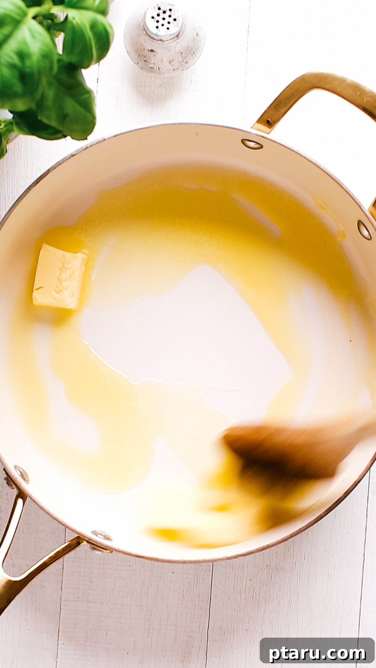 How to Make Garlic Cream Sauce 5 Butter melting in a large saucepan.